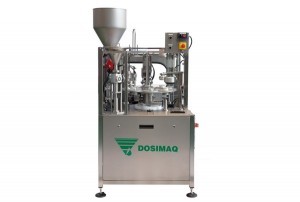 AUTOMATIC MACHINE FOR FILLING AND CLOSING RIGID, UPSTACKING CONTAINERS